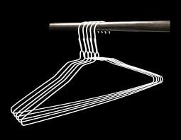 100 standard white clothes hangers - 18" white shown in use